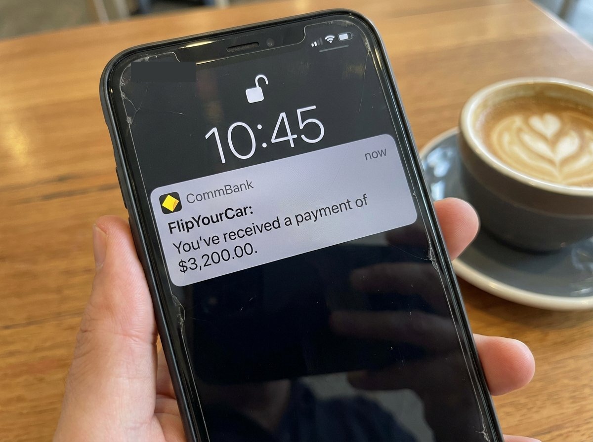 Phone notification showing $3,200 AUD payment from FlipYourCar received via OSKO